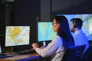 Diverse call center operators team use computers consulting clients in office photo