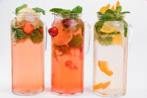 set with different fruits cocktails on white background photo