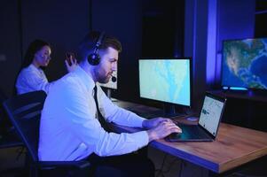 Photo of a successful dispatcher working on a computer in the office