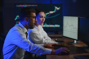 Business team investment working with computer, planning and analyzing graph stock market trading with stock chart data photo