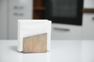 Wooden napkin holder in kitchen photo