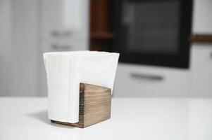 Wooden napkin holder in kitchen photo