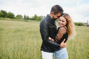 happy couple in love at sunset and smiling photo