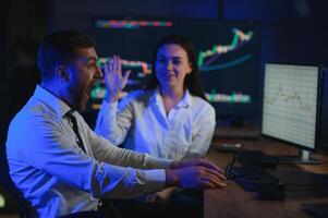 Business team investment working with computer, planning and analyzing graph stock market trading with stock chart data photo