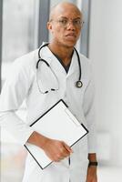 young male african doctor in hospital. photo