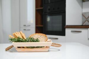 Craft wooden plate for storing bread or vegetables in the kitchen photo