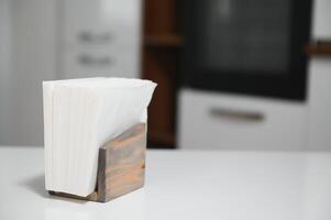 Wooden napkin holder in kitchen photo