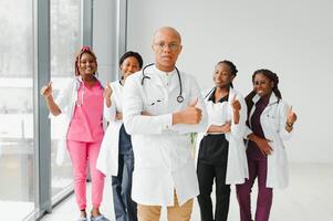 group of young african medical workers on white background. photo