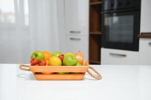 handmade kraft box with fruits and vegetables on kitchen background. photo