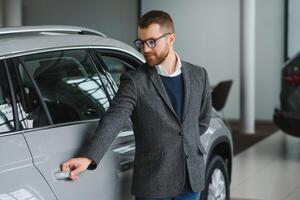 Man adult customer male buyer client wears classic suit white shirt chooses auto photo