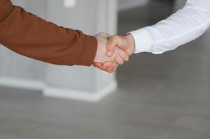 Close-up image of a firm handshake standing for a trusted partnership photo