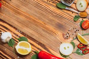 Cooking table. Background with spices and vegetables. Top view. Free space for your text. photo