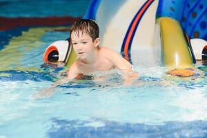 boy is in the water park. photo