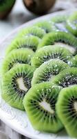 AI generated Slices of vibrant green kiwi arranged in a circular pattern on a white plate, generative AI, background image photo