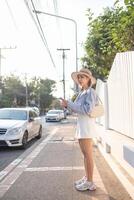 Traveler Asian woman traveling and walking in Bangkok Chiang Mai Temple, Thailand, backpacker female feeling happy spending relax time in holiday trip photo