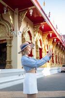 Traveler Asian woman traveling and walking in Bangkok Chiang Mai Temple, Thailand, backpacker female feeling happy spending relax time in holiday trip photo