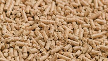 looped close-up rotation of compacted wooden sawdust pellets video