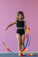 Future champion in rhythmic gymnastics. Children's sports competitions. Children's training photo