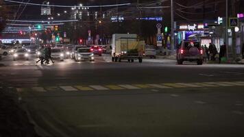 pedestrians crossing central prospect at winter night video