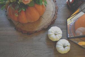 Pumpkins on the table. Flower composition. Home decoration. Atmospheric photo. photo