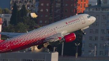 SOCHI, RUSSIA - AUGUST 02, 2022 - Airbus A320-214, RA-73207 of Rossiya aircraft taking off at Sochi airport, side view. Tourism and travel concept video