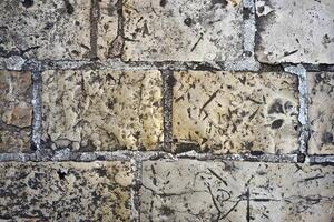 Background with gray stone blocks from crumbs. Grunge pattern photo