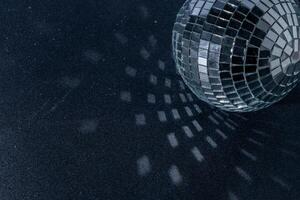 Mirror disco ball. Black background. photo