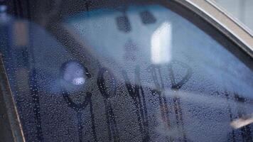 a car window with the word covid written on it video