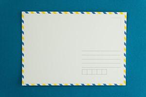 Blank postcard of an open letter. Mail background. Postcrossing layout place for text top view. Postal background. Stamp delivery envelope. Mockup copy space. photo