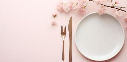 AI generated plate on white table, pink flowers, fork and knife photo