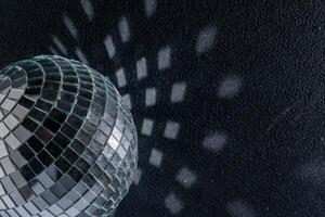 Mirror disco ball. Black background. photo