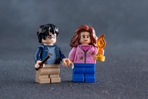 Lego Harry Potter and Hermione minifigures. Children's designer toy made of bricks and plastic parts. Ukraine, Kyiv - January 17, 2024 photo