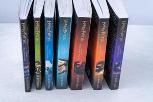 A stack of books about Harry Potter by writer JK Rowling. Collection book. Ukraine, Kyiv - January 26, 2024. photo