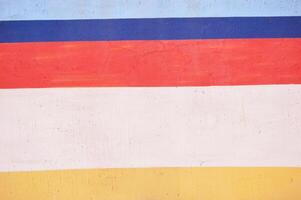 Abstract background of red blue, yellow and white stripes. photo