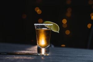 Tequila shot with lime . Selective focus photo