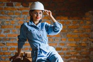 Female builder at work on site photo