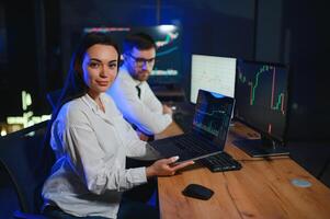 Business team investment working with computer, planning and analyzing graph stock market trading with stock chart data photo