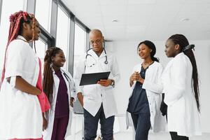 group of young african medical workers on white background photo