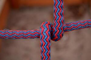 Knot on a colorful rope. Tools for climbing. photo