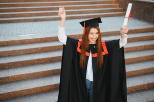 Woman portrait on her graduation day. University. Education, graduation and people concept. photo