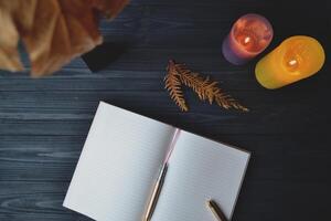 Notebook on the wooden desk with place for text. Stylish workplace background. Workplace design. photo