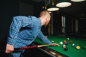 Playing billiard - Close-up shot of a man playing billiard photo