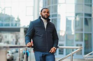 African American man in stylish new clothes on the street photo