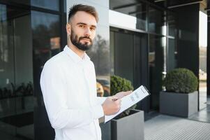 Male real estate agent with key in room. Banner for design photo