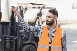 young worker in warehouse background photo