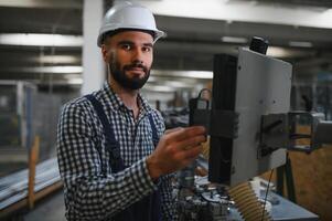 Factory worker. Man working on the production line. photo