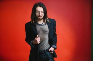 Gay man on a colored background in the studio. The concept of the LGBTQ community. Equality. photo