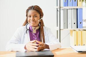 Portrait of a friendly black female doctor. photo