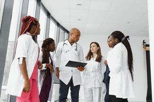 group of young african medical workers on white background. photo