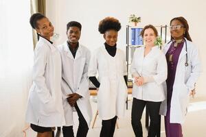 Group of doctors and nurses set in a hospital. photo